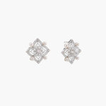 Ornate sterling silver stud earrings with mandala-inspired filigree pattern and four freshwater pearls on beige background