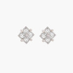Ornate sterling silver stud earrings with mandala-inspired filigree pattern and four freshwater pearls on beige background