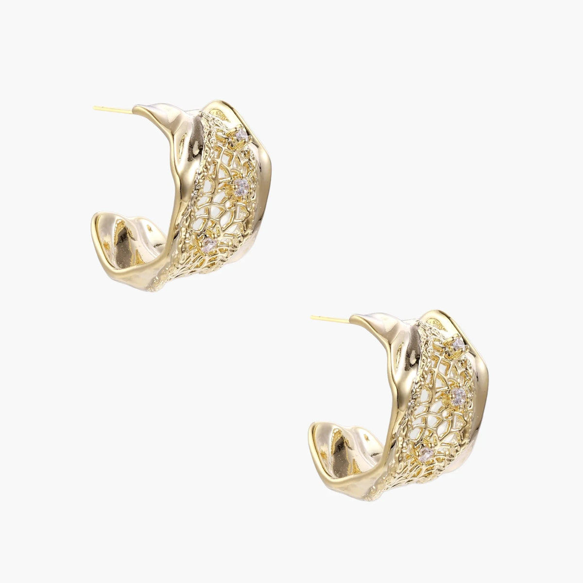 Gold-plated sculptural hoop earrings with geometric lattice centerband and sparkling zirconia on white background.