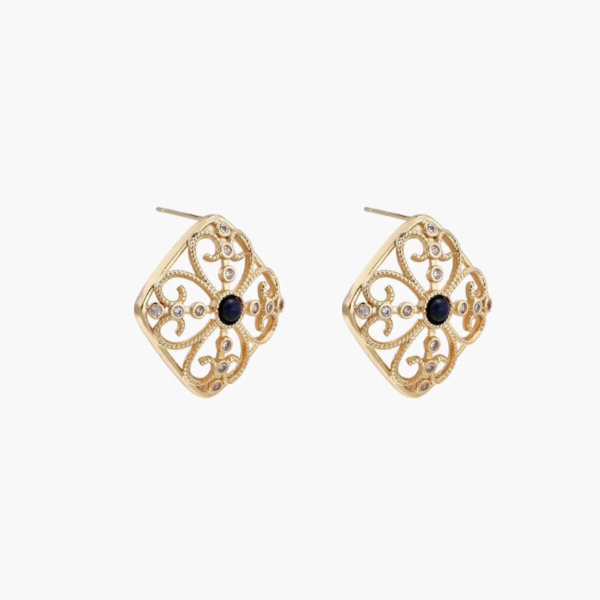 Gold filigree stud earrings with navy lapis lazuli center stone and mother-of-pearl accents in ornate quatrefoil design