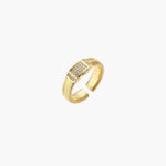 Gold-plated adjustable ring with ribbed band and rectangular pavé cubic zirconia panel on white background.