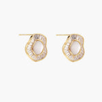 14K gold-plated stud earrings with freshwater pearl center surrounded by baguette-cut crystal halo in sunburst design